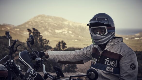 Rider wearing white Fuel Rally Raid Motorcycle Jacket