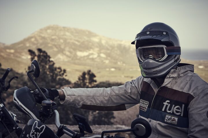 Rider wearing white Fuel Rally Raid Motorcycle Jacket