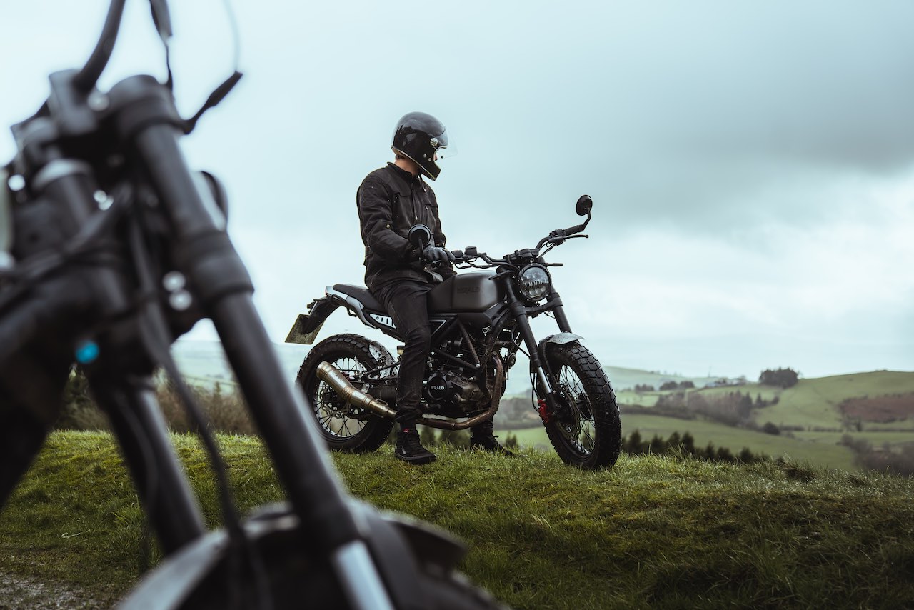 Rider in Wales sitting on Herald Motor Co. Brat 125