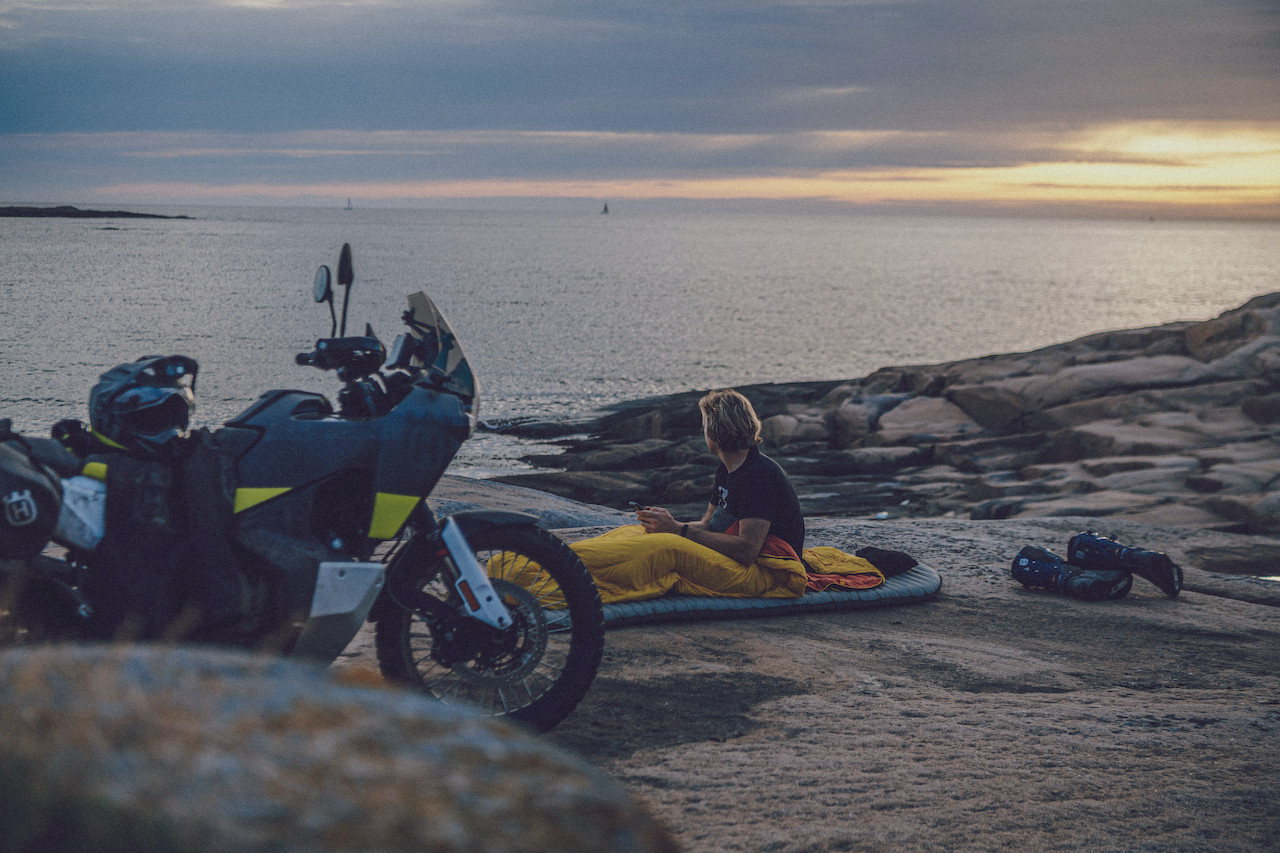 Husqvarna Norden 901 parked while rider sets wild camp