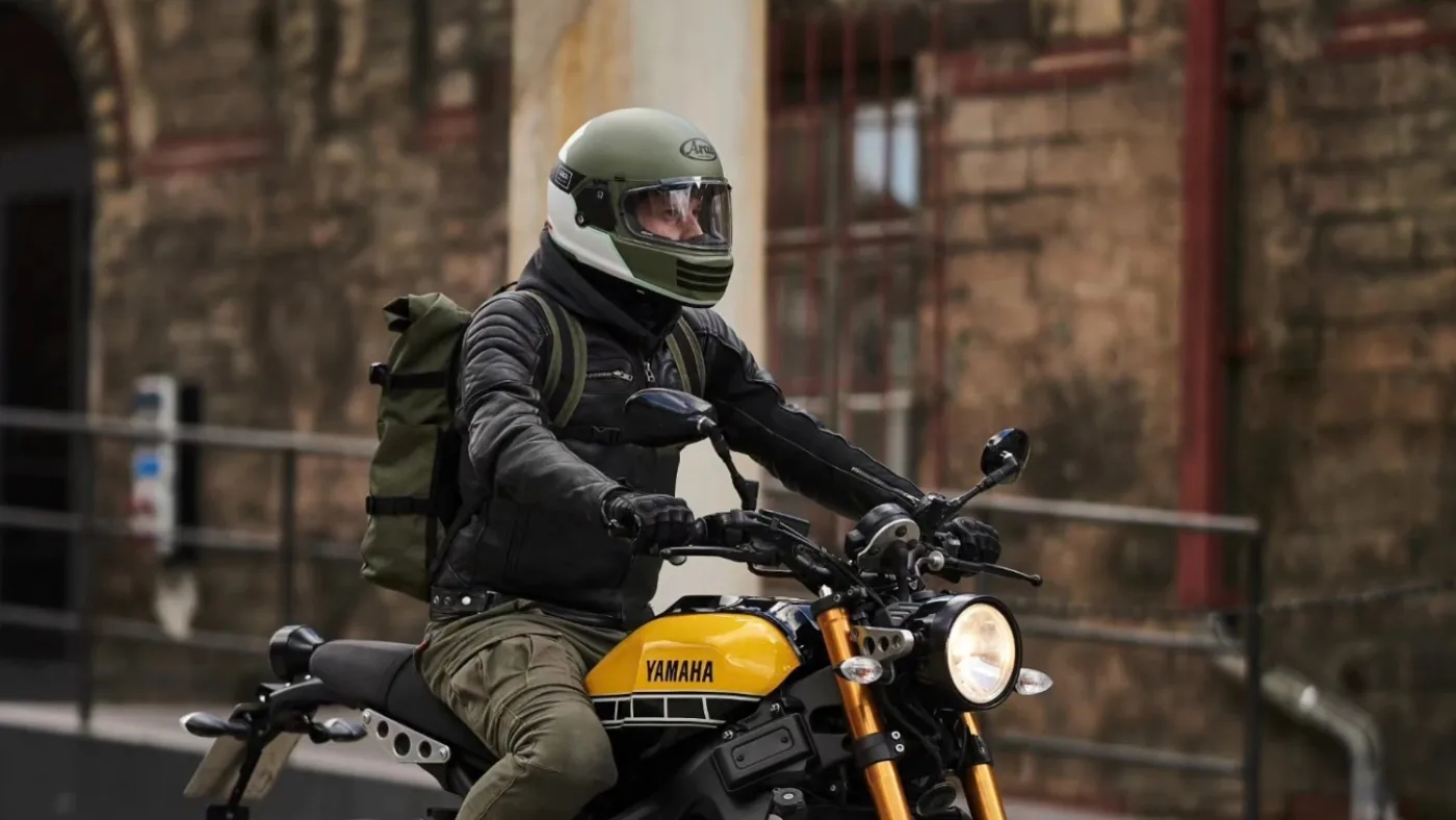 Best Retro Motorcycle Helmets 2026: Vintage Café Racer Style 18 Rider wearing the Arai Concept X retro helmet