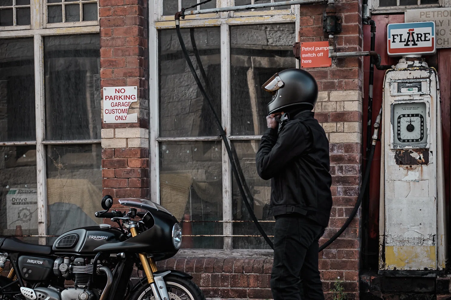 Rider wearing Air Tate jacket and Hedon Heroine helmet - next to a Triumph Thruxton