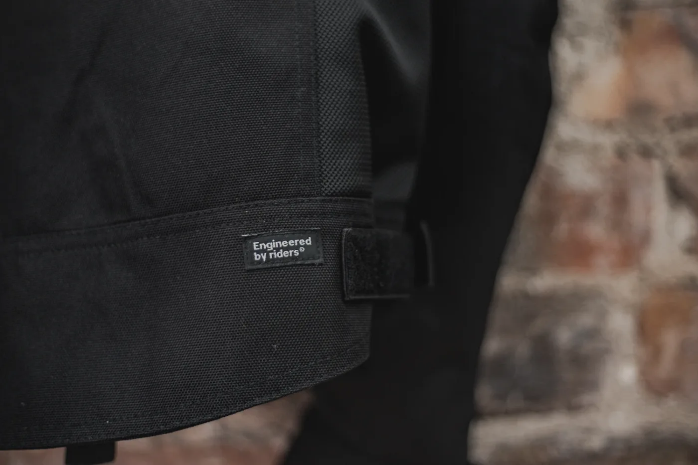 Engineered by Riders tagline on the drop-tail hem of the jacket