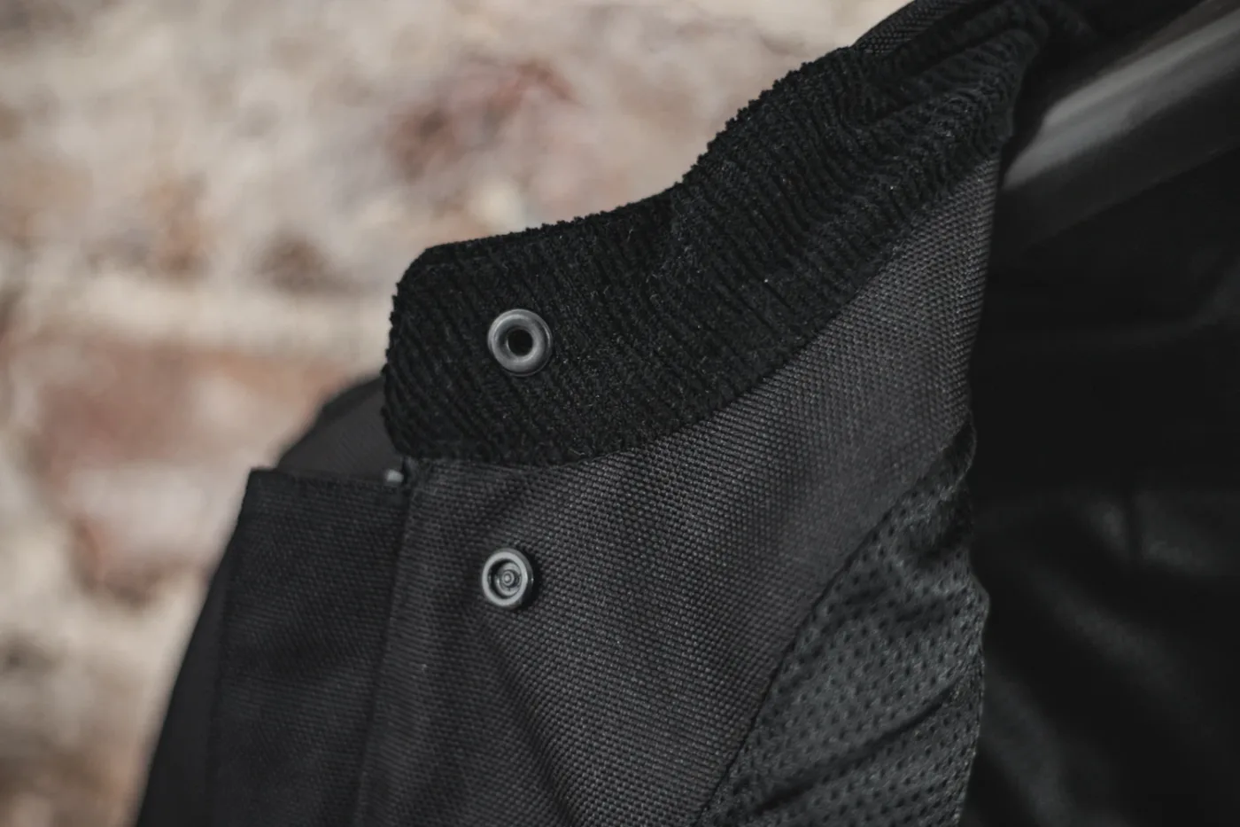 Cord collar lining and snap-in button close-up
