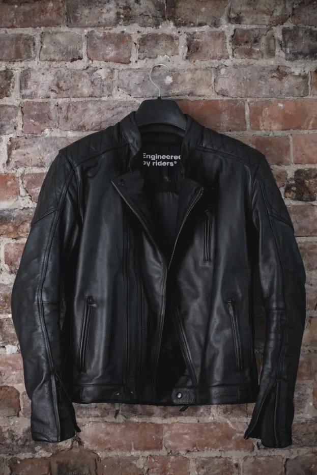 Pando Moto Twin Leather Jacket Review - Road Tested over 620 miles: Looks and Excellent Performance 10 Pando Moto Twin Leather Jacket hanging on a red brick wall 2