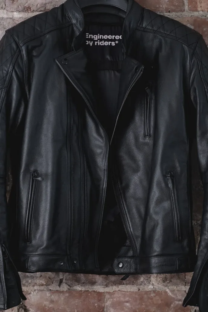 Pando Moto Twin Leather Jacket Review - Road Tested over 620 miles: Looks and Excellent Performance 29 Pando Moto Twin Leather Jacket hanging on a red brick wall 2