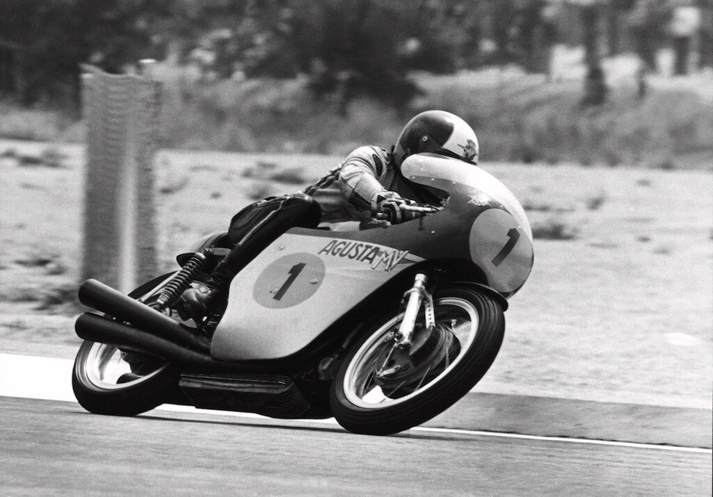How a Grand Prix World Champion Helped Make Full-Face Motorcycle Helmets the Norm 30 Giacomo 'Ago' Agostini dropping into the corner during a Motorcycle Grand Prix race on the MV Agusta 500 factory racer
